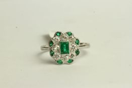 Art Deco Emerald and Diamond Ring, set with a centre emerald, surrounded by 8 diamonds and 8