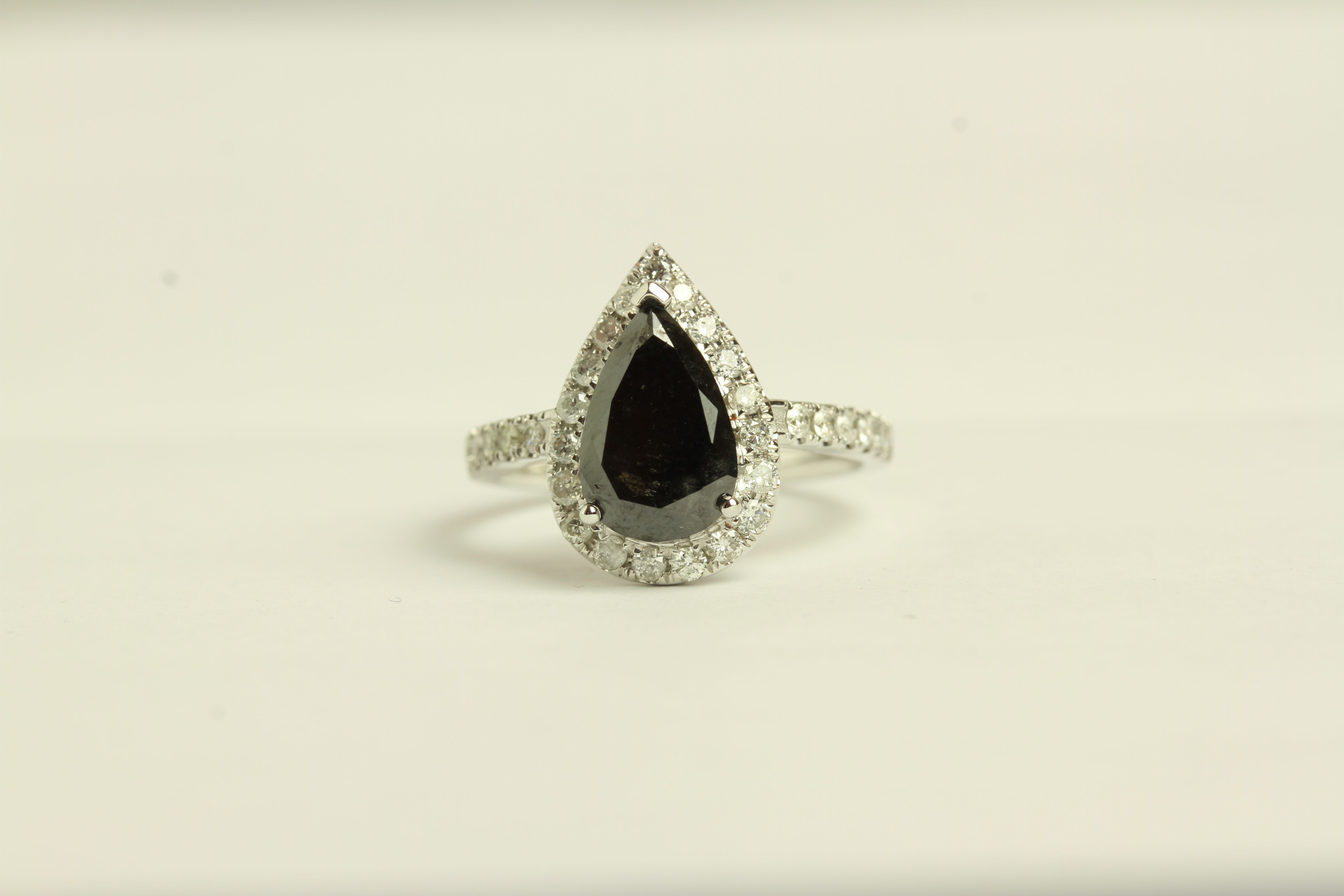 Black and White Diamond ring, set with 1 pear cut black diamond approximately 2.38ct,