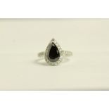 Black and White Diamond ring, set with 1 pear cut black diamond approximately 2.38ct,