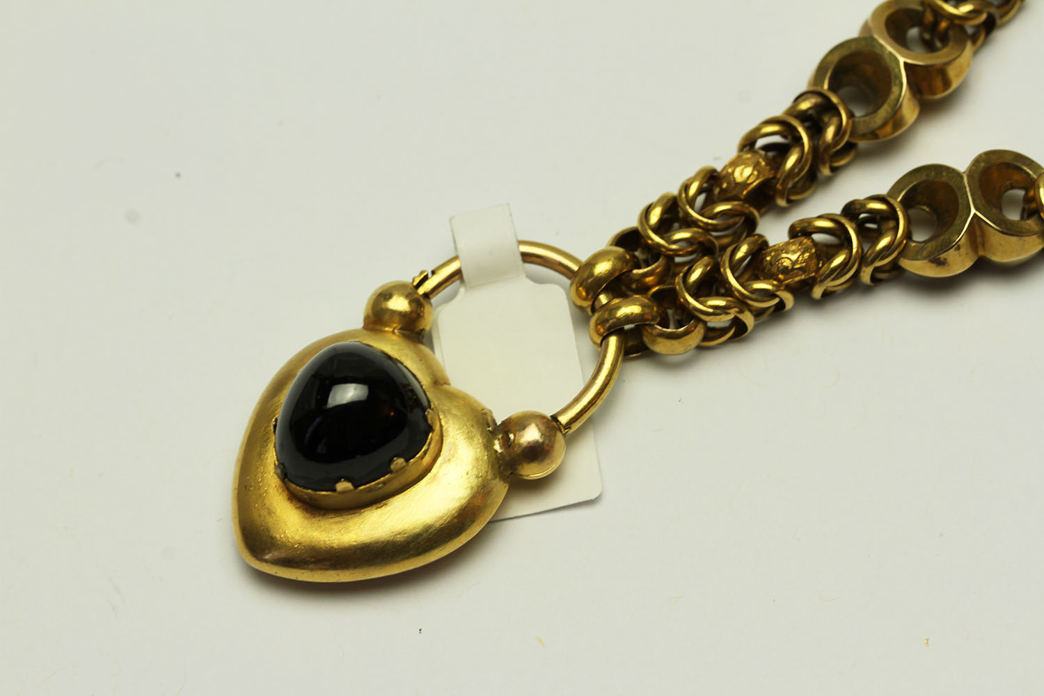 Victorian Garnet Set Charm Bracelet, set with a cabochon cut garnet on a heart shaped charm,