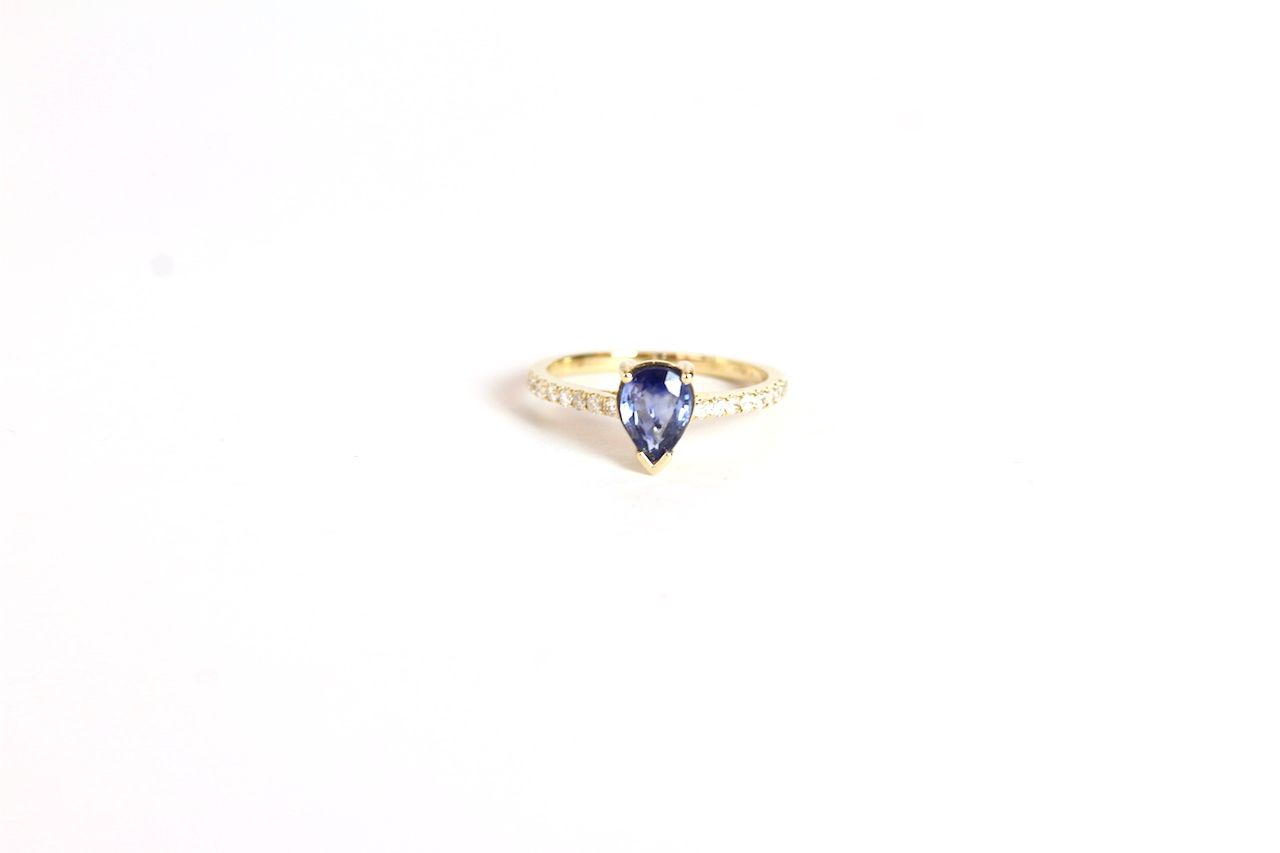 Sapphire and Diamond ring, set with a pear cut natural sapphire totalling approximately 1.05ct