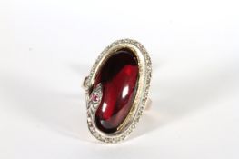 Georgian Garnet Snake Ring, set with a cabochon cut garnet, featuring a snake around the edge set