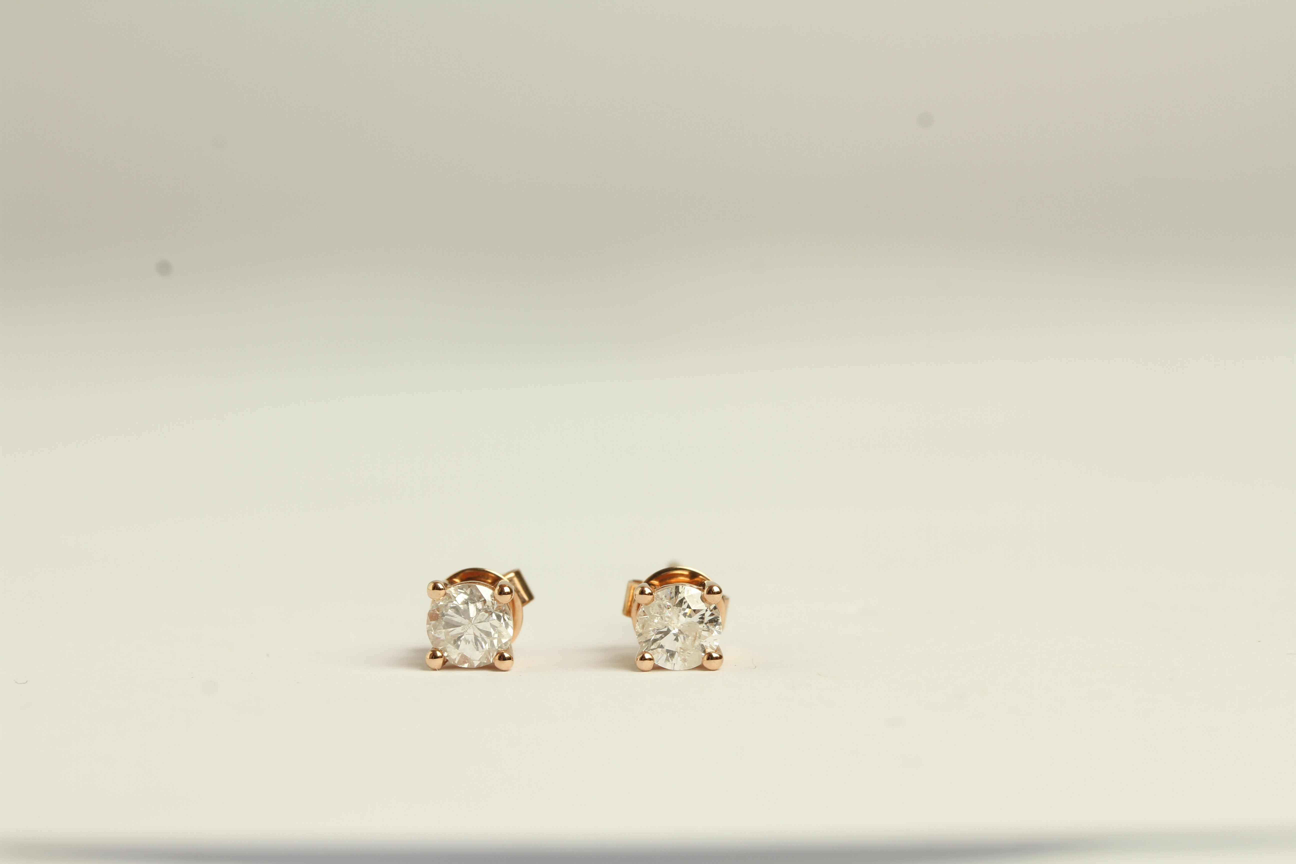 Pair of Diamond stud earrings, set with a total of 2 round brilliant cut diamonds