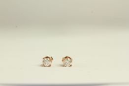 Pair of Diamond stud earrings, set with a total of 2 round brilliant cut diamonds