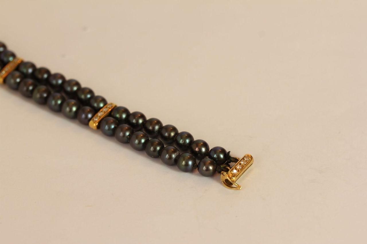 HAEMATITE TWO ROW BRACELET WITH YELLOW METAL DIAMOND SET BARS AND CLASP, black stones estimated as - Image 2 of 2