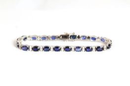 Sapphire and Diamond bracelet, set with 21 oval cut sapphires totalling approximately 11.24ct