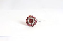 .Ruby and diamond pendant, central cabochon cut ruby 10.3x8.8mm, a border of brilliant cut diamonds,