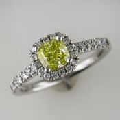 PLATINUM NATURAL INTENSE YELLOW CUSHION SHAPED DIAMOND AND WHITE STONE CLUSTER RING WITH GIA