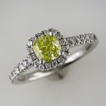 PLATINUM NATURAL INTENSE YELLOW CUSHION SHAPED DIAMOND AND WHITE STONE CLUSTER RING WITH GIA