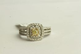 Natural Fancy Yellow and White Diamond Ring, set with 1 cushion cut yellow diamond,