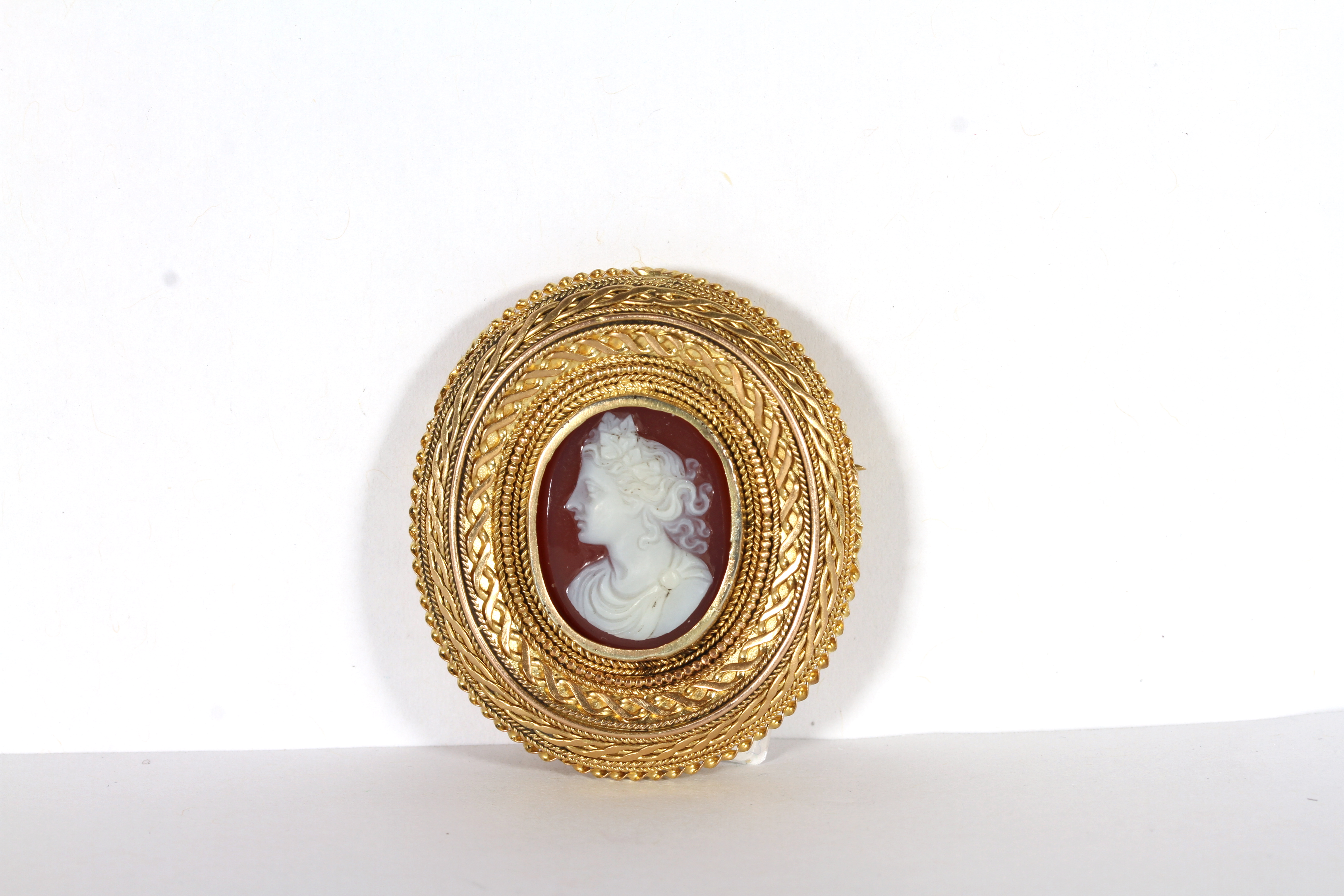 Australian Interest - Gaunt, Melbourne 1829-1890, A signed cameo brooch, central hard stone cameo