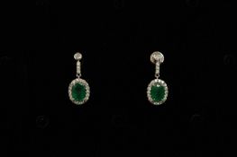 Pair of Emerald and Diamond drop earrings, set with 2 oval cut Emeralds