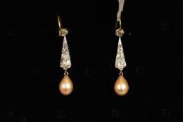 Pearl and diamond drop earrings, a single peach coloured drop pearl suspended from old cut diamond