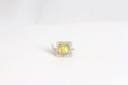 Opal and diamond cluster ring, large round cabochon cut opal approximately 11.5mm, set within a