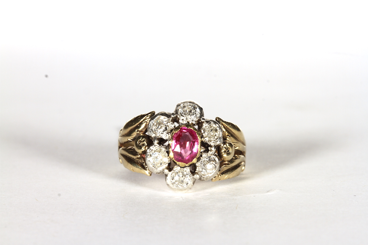 Georgian Ruby and Diamond Cluster ring, central oval cut ruby, surrounded by six old cut diamonds,