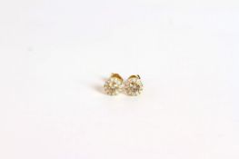 Pair of Diamond stud earrings, set with 2 round brilliant cut cognac diamonds