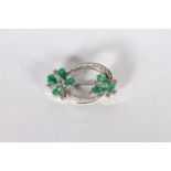 14CT WHITE GOLD EMERALD AND DIAMOND BROOCH ,PRONG SET AND STYLED AS TWO FLOWERS WITH EMERALD