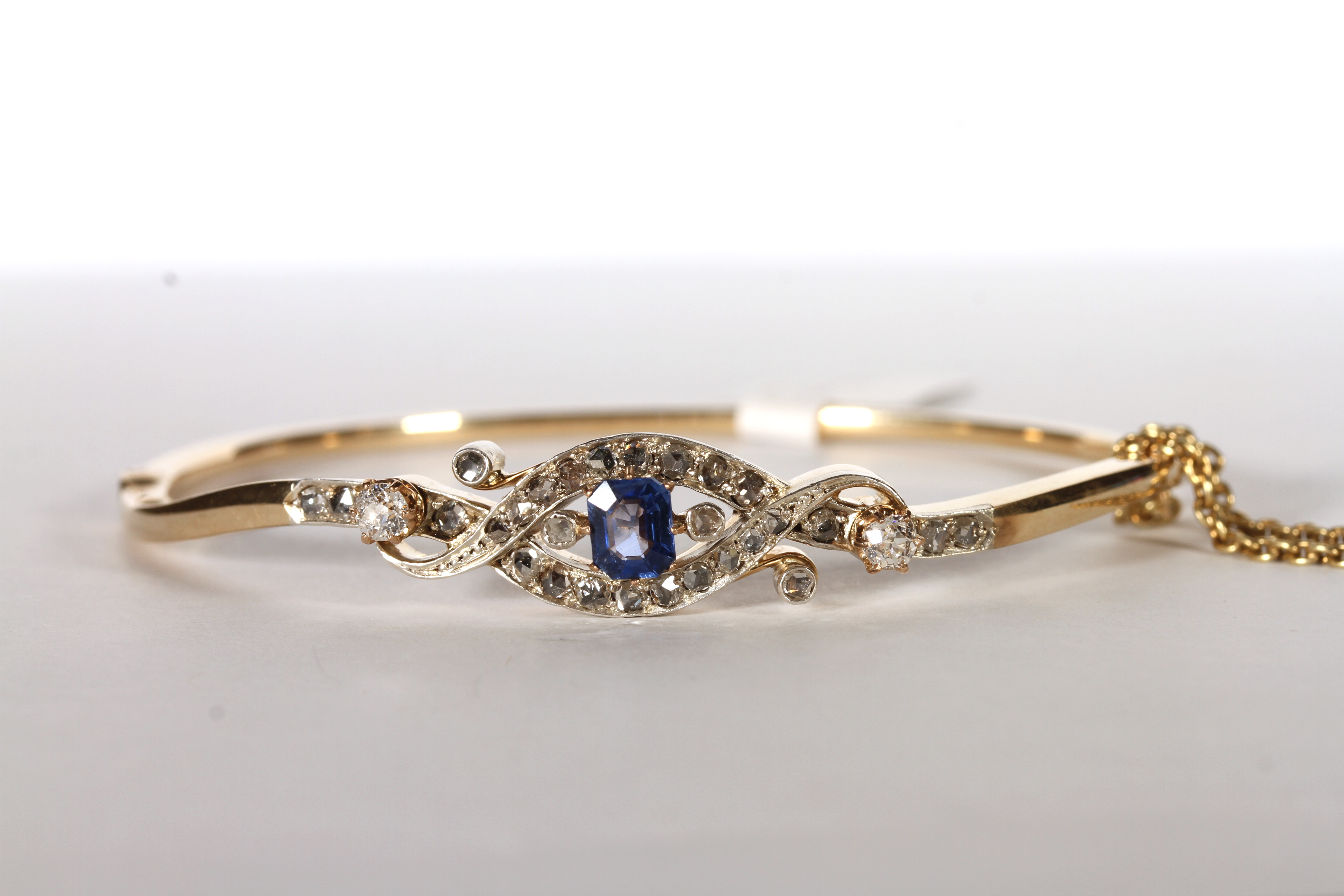 Victorian Sapphire and Diamond Bangle, set with a sapphire approximately 0.30ct, claw set,