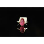 PLATINUM PINK CABOCHON CUT PINK SAPPHIRE WITH DIAMOND SHOULDERS,centre stone estimated as 10.4 x 6.