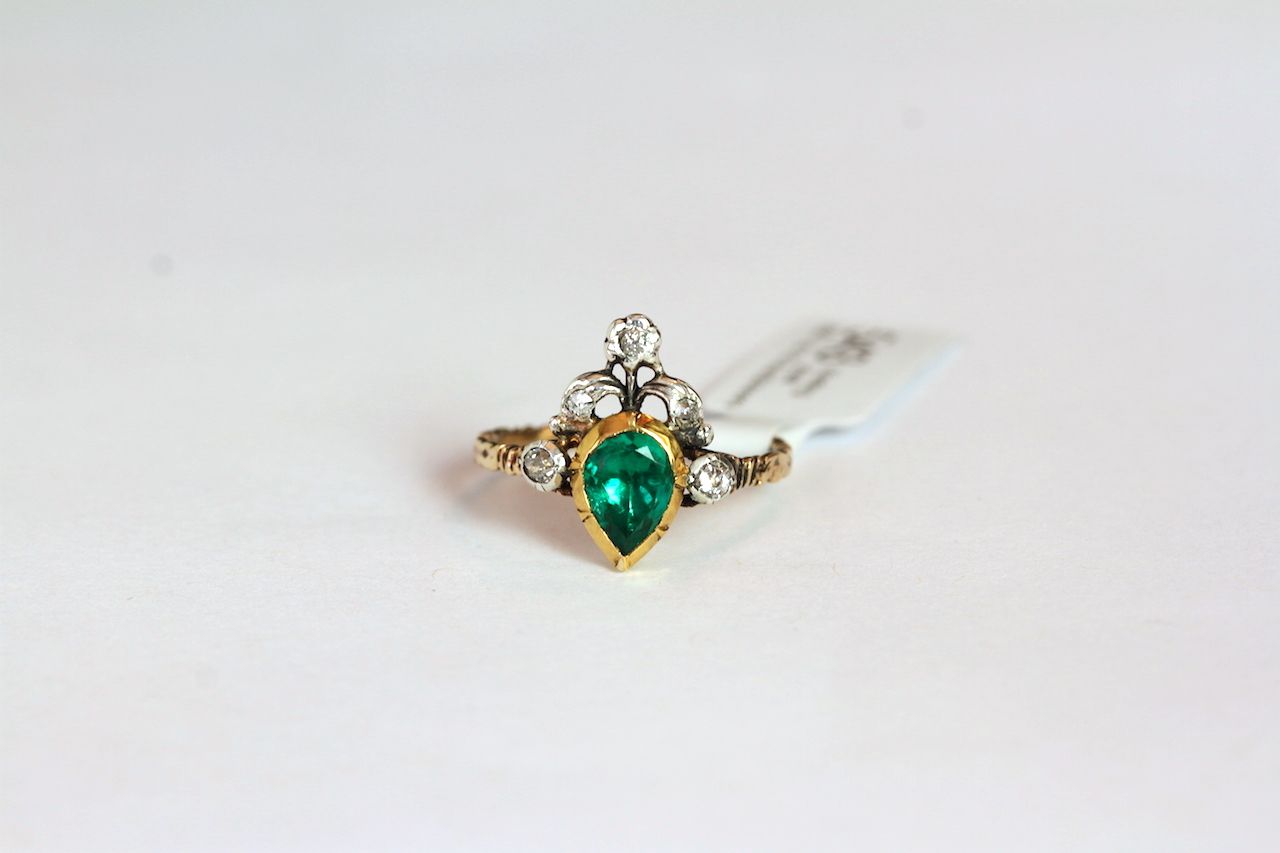 Georgian Emerald and diamond ring, pear cut emerald set in a closed back setting, approximately 6.