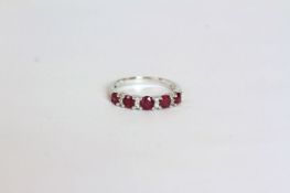 Ruby and Diamond ring, set with 5 round cut rubies totalling approximately 1.12ct
