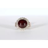 Victorian Garnet and Diamond ring, central 11mm round cabochon garnet mounted with a border of old