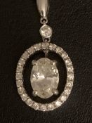 18K WHITE GOLD OVAL DIAMOND CLUSTER PENDANT , CENTRE STONE ESTIMATED AS 0.72CT WITH A DIAMOND