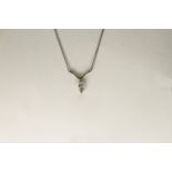 PLATINUM MARQUISE AND BAGUETTE CUT PENDANT, centre stone estimated as 12.6x3.48mm, other 2 stones