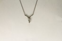 PLATINUM MARQUISE AND BAGUETTE CUT PENDANT, centre stone estimated as 12.6x3.48mm, other 2 stones