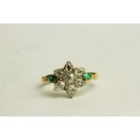 Emerald and Diamond Flower Style Ring, set with 7 diamonds and 2 emeralds, yellow metal not