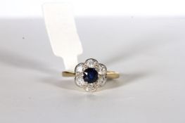 Sapphire and Diamond Flower Ring, set with a sapphire approximately 0.72ct, surrounded by 6 diamonds