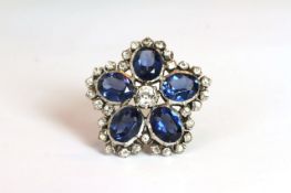 Antique paste set ring, five large blue oval cut paste stones set around a central round cut white