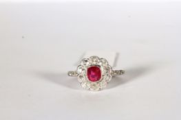 Ruby and Diamond Flower Ring, set with a ruby approximately 0.70ct, surrounded by diamonds totalling