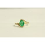Emerald and Diamond twist ring, set with 1 oval cut emerald approximately 1.13ct
