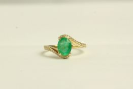 Emerald and Diamond twist ring, set with 1 oval cut emerald approximately 1.13ct