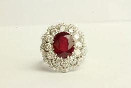 Ruby and Diamond Cluster Ring, set with an oval cut ruby approximately 5.67ct