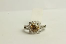 Fancy Colour Diamond Square Halo Ring, set with 1 round brilliant cut cognac diamond