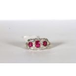 Ruby and Diamond Cluster Ring, set with 3 rubies, surrounded by diamonds, finger size M 1/2.