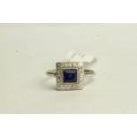Sapphire and Diamond ring, set with a centre princess cut sapphire approximately 0.93ct,