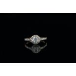 Diamond cluster ring, set with 1 round brilliant cut diamond approximately 0.72ct