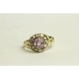 Pink Sapphire and Diamond Ring, set with a centre pink sapphire approximately 1.28ct, surrounded