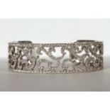 Brilliant cut diamond bangle, brilliant cut diamonds mounted across an open bangle, scrolling centre