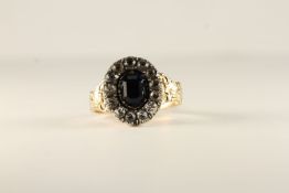 Early 20th Century blue and white paste cluster ring, old cut stones, set in silver, closed back