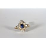 Sapphire and Diamond Ring, set with an oval cut sapphire approximately 0.63ct, surrounded by 8