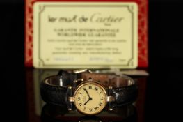 LADIES CARTIER DE MUST 18014295, round, gold dial with black hands, black roman numeral markers,