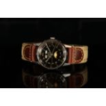 GENTLEMANS ZODIAC, round, black dial with illuminated hands, gold baton markers, day-date at 12 o