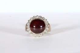 Victorian Garnet and Diamond ring, central 11mm round cabochon garnet mounted with a border of old