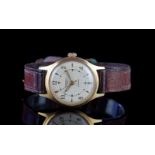 GENTLEMENS INGERSOLL SHOCKPROOF WRISTWATCH, circular waffle dial with gold Arabic numerals and