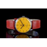 GENTLEMENS GIRARD PERREGAUX WRISTWATCH, circular yellow/orange dial marked with a Ferrari badge,