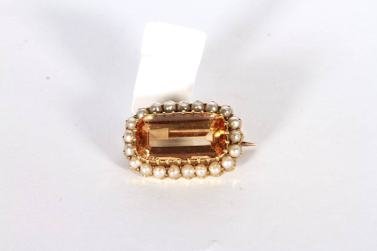 Victorian Imperial Topaz and Pearl Brooch, central rectangular Imperial topaz, approximately 6.83ct,